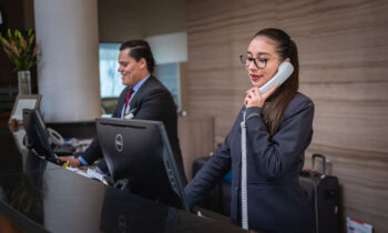 role description for receptionist in hotel in UAE